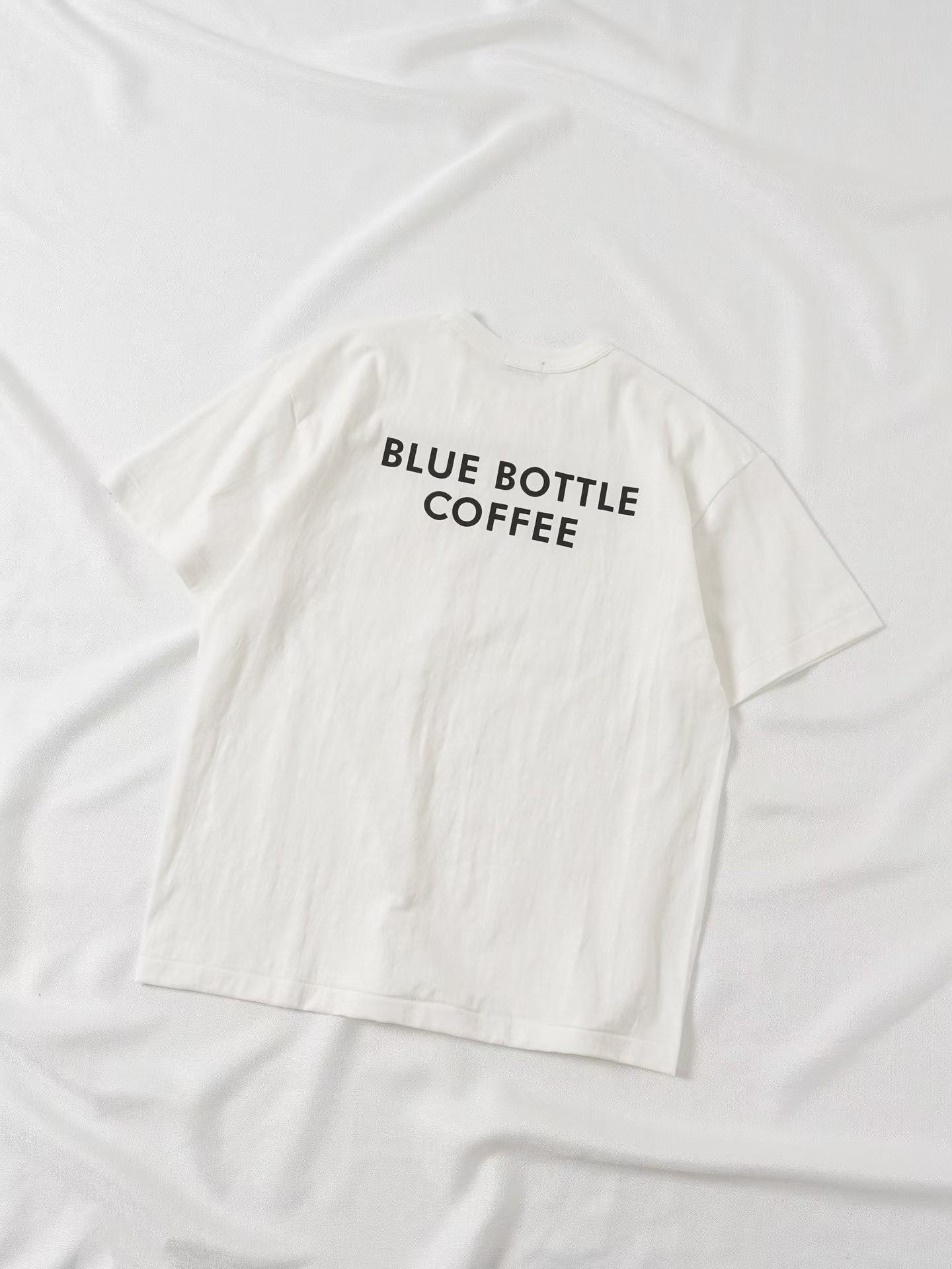 Human made blue bottle tee