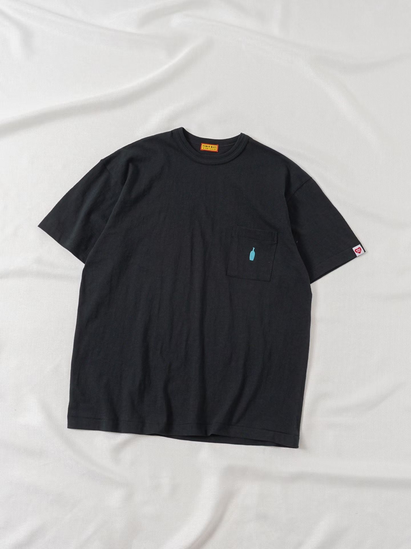 Human made blue bottle tee