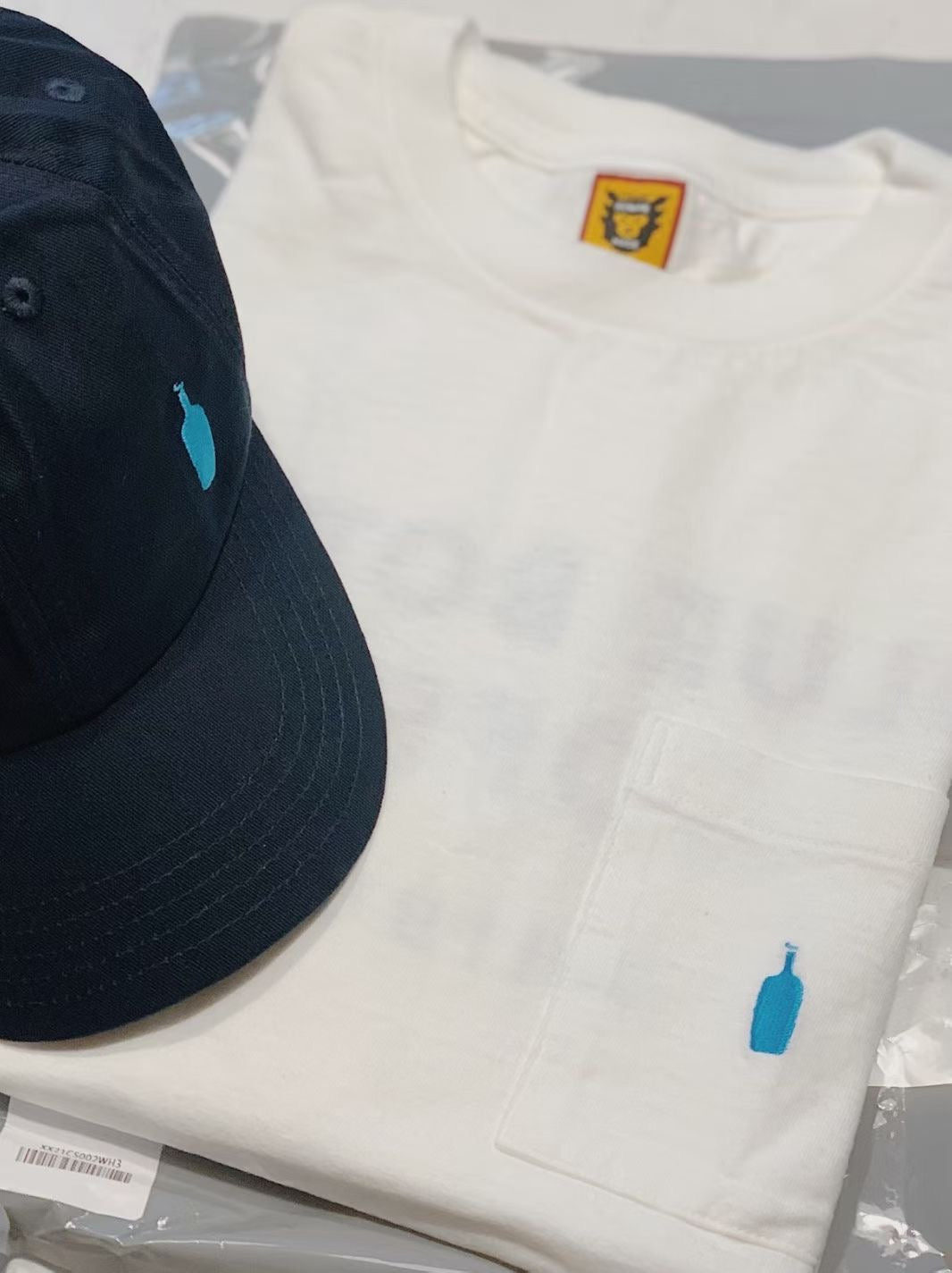 Human made blue bottle tee