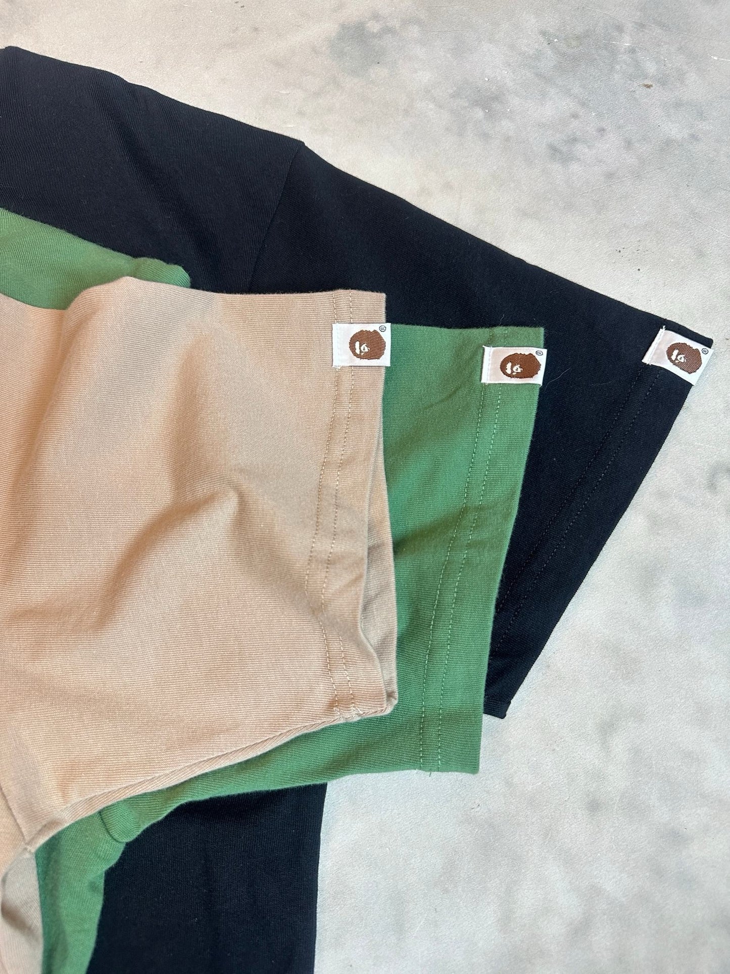 A bathing ape 猿人logo tee