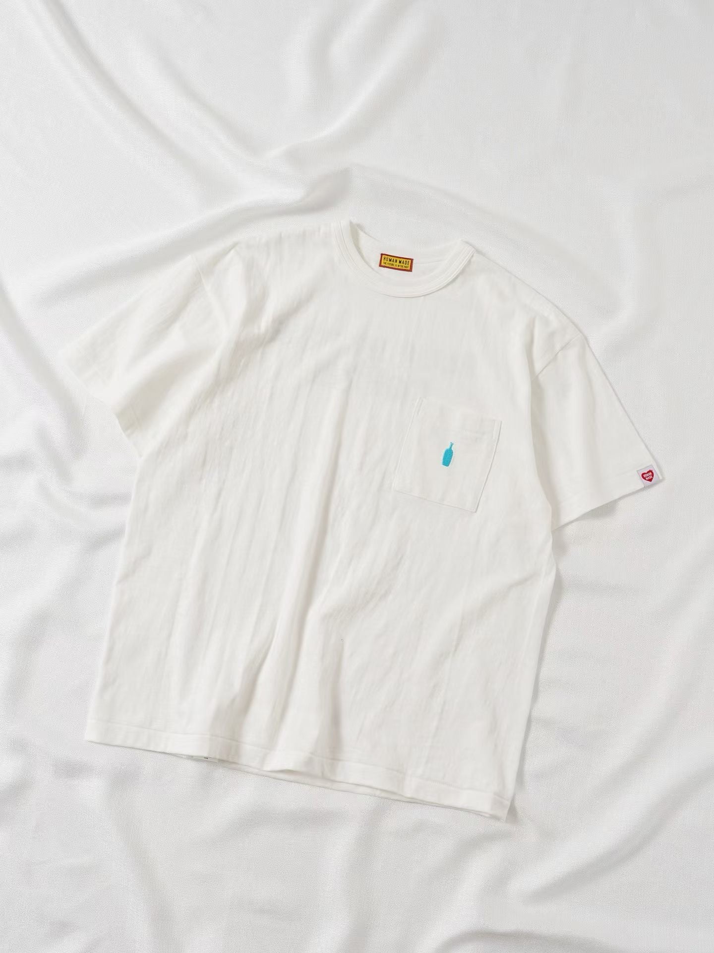 Human made blue bottle tee