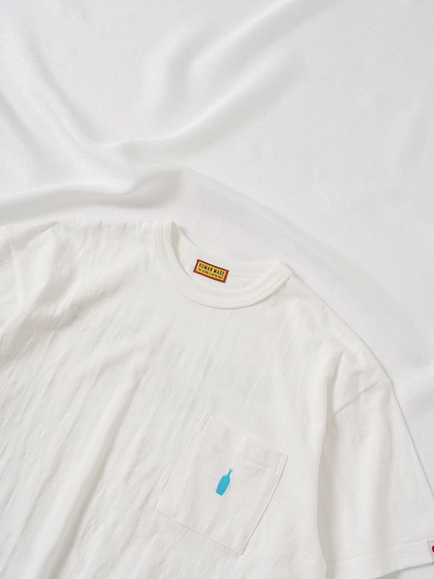 Human made blue bottle tee